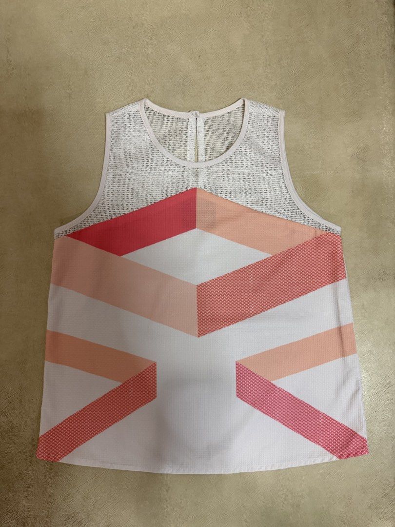 Plains & Prints Geometric Print Mesh Sleeveless Top (Category: Blouses) located in Manila. Submitted by abigailyao21949 (Listing ID 1464190216, Image 1). Description: Plains & Prints Geometric Print Mesh Sleeveless Top •Size: S •Price: 490 php •In good condition - Color: White with pink and coral geometric pattern - Details: Mesh neckline and upper back.