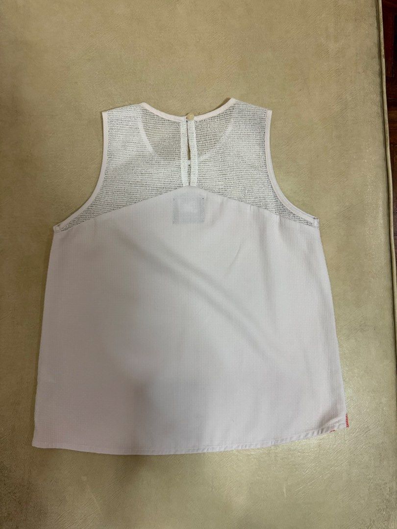 Plains & Prints Geometric Print Mesh Sleeveless Top (Category: Blouses) located in Manila. Submitted by abigailyao21949 (Listing ID 1464190216, Image 2). Description: Plains & Prints Geometric Print Mesh Sleeveless Top •Size: S •Price: 490 php •In good condition - Color: White with pink and coral geometric pattern - Details: Mesh neckline and upper back.