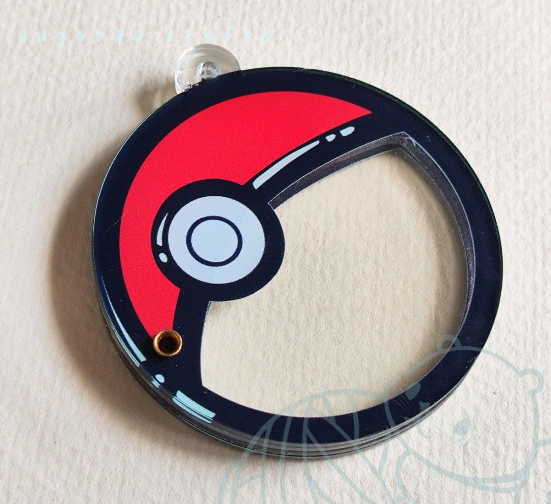 Pokemon Pokeball Shaker Charm Keychain custom (Category: Character Goods) located in Mandaue City. Submitted by regdeclutters (Listing ID 1464202253, Image 3). Description: Classic red and white pokeball design! Comes with 5 charms of your choice. (Maximum of 2pcs per charm design) ⋆˚꩜｡ ᯓ★ Approx 6cm ᯓ★ Acrylic w/ magnet ᯓ★ Ball chain (black) **Choose your 5 charms by adding them to the checkout notes, please! ♡(੭´͈ ᐜ `͈)੭ May contain small air b