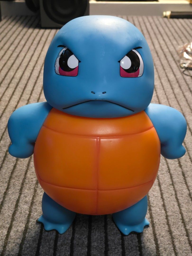 Pokemon Squirtle Figure Toy (Category: Figurines & Statues) located in Baguio. Submitted by sonny14 (Listing ID 1464180836, Image 3). Description: PVC or vinyl [1:1 scale life-size / approx. 16-17 inch Squirtle figure from Pokémon featuring an annoyed or "tsundere" facial expression with furrowed brows. Size: Approximately 16 to 17 inches (around 40–43 cm) tall as measured by the tape. Issues.light scratches and eye paint issue Pm for more detail