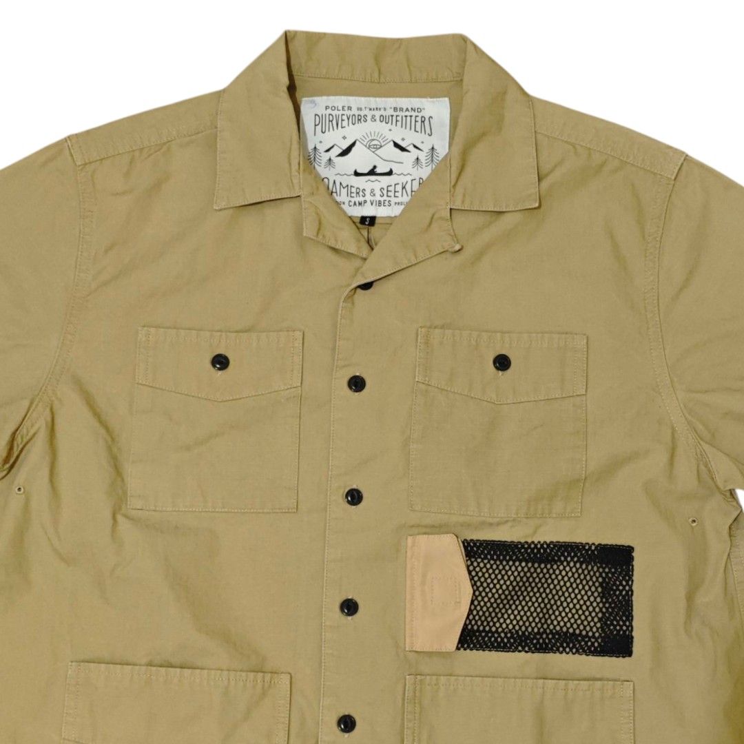 POLER JP Short Sleeve Utility Camp Shirt (Category: Tshirts & Polo Shirts ) located in Quezon City. Submitted by oldturnedtogold (Listing ID 1464165044, Image 3). Description: POLER JP Short Sleeve Utility Camp Shirt Size Small Beige Shoulder Width - 18.5" Body length - 26" Chest width - 23" Sleeve Length - 8.5" Details: - 100% cotton fabric - camp collar - 4 front patch pockets alongside a distinct mesh panel pocket on the left side - button fro