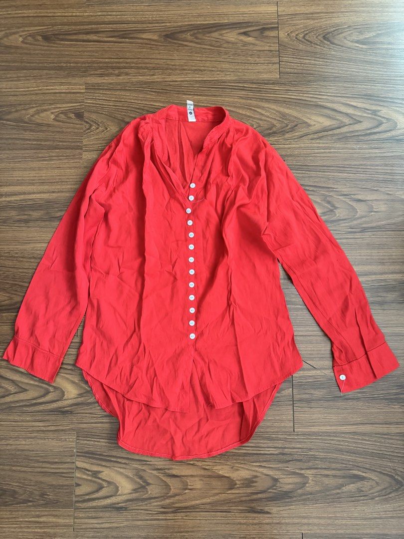 Polly Collections Red Button-Up Blouse (Category: Blouses) located in Rizal. Submitted by thrifty.mom (Listing ID 1464279820, Image 1). Description: - Red long-sleeved blouse - Brand: Polly Collections - V-neck with button-up front - Curved hemline - Measurements: Pit to pit approx 21 inches, length approx 30 inches - Ideal for casual wear.
