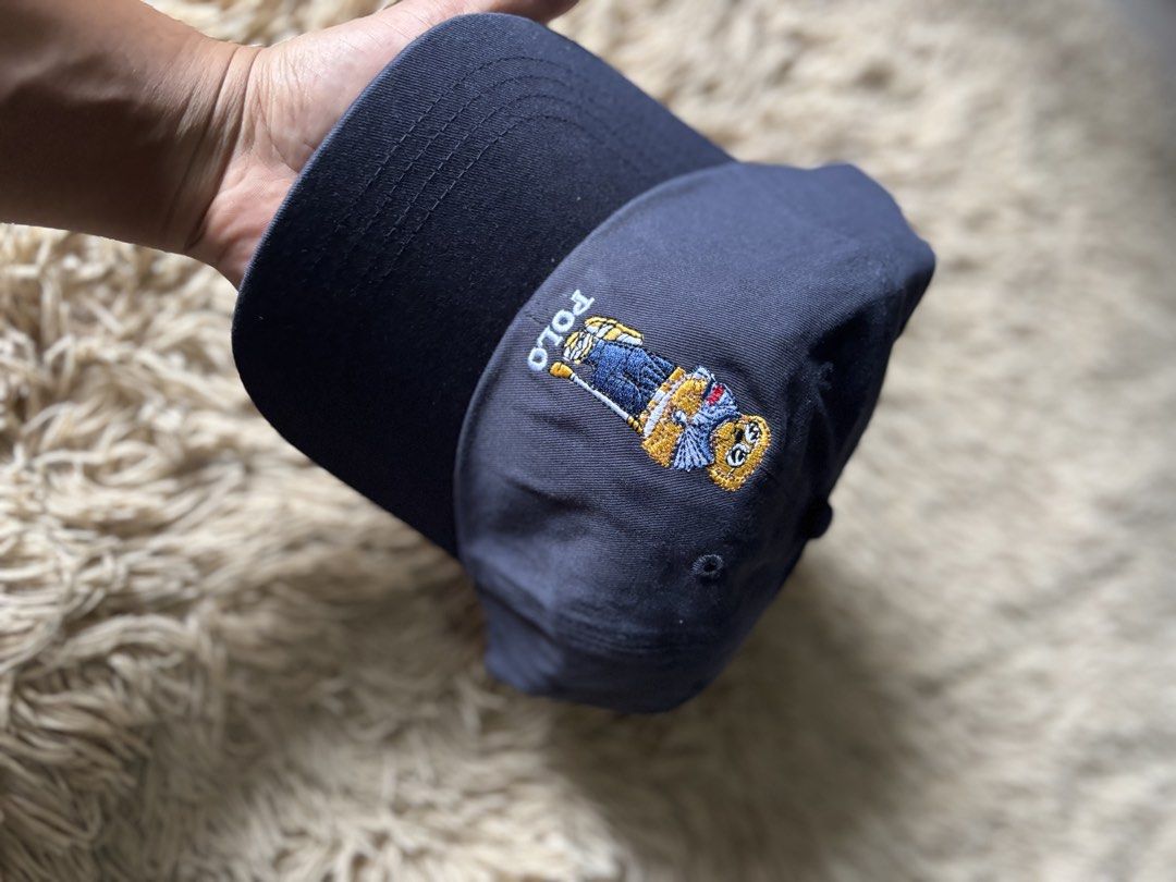 Polo Ralph Lauren Bear Cap Navy Blue (Category: Caps & Hats) located in Quezon City. Submitted by nojthrift (Listing ID 1464250943, Image 2). Description: - Classic navy blue Polo Ralph Lauren cap - Features iconic Polo Bear embroidery on the front - Adjustable strap at the back for a comfortable fit - Made with quality materials for durability - Perfect for everyday casual wear - Polo Ralph Lauren logo visible on the inside band.