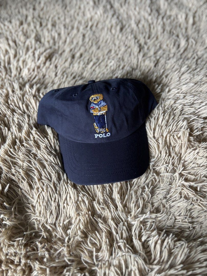 Polo Ralph Lauren Bear Cap Navy Blue (Category: Caps & Hats) located in Quezon City. Submitted by nojthrift (Listing ID 1464250943, Image 1). Description: - Classic navy blue Polo Ralph Lauren cap - Features iconic Polo Bear embroidery on the front - Adjustable strap at the back for a comfortable fit - Made with quality materials for durability - Perfect for everyday casual wear - Polo Ralph Lauren logo visible on the inside band.