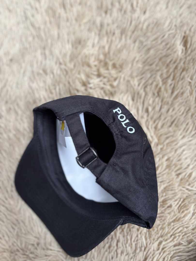 Polo Ralph Lauren Black Cap (Category: Caps & Hats) located in Quezon City. Submitted by nojthrift (Listing ID 1464251776, Image 3). Description: - Classic black cap from Polo Ralph Lauren - Iconic polo player logo embroidered on the front - 'POLO' embroidered on the back - Adjustable strap for a comfortable fit - Made from 100% cotton - One size fits most.