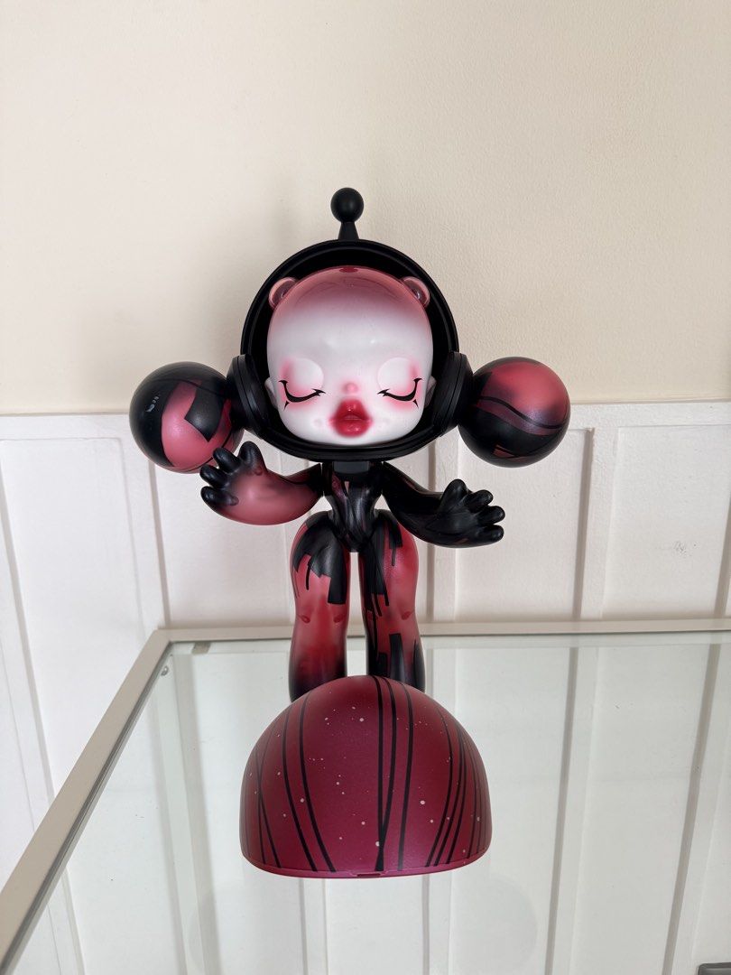 Popmart Skull Panda 400% (Category: Figurines & Statues) located in Cainta. Submitted by mskath__ (Listing ID 1464169845, Image 2). Description: - Unique designer art toy figure - Robot-like design with red and black accents - Pink gradient head with closed eyes and makeup - Includes a separate base piece - Stands approximately 8-10 inches tall - Perfect for collectors - no box.