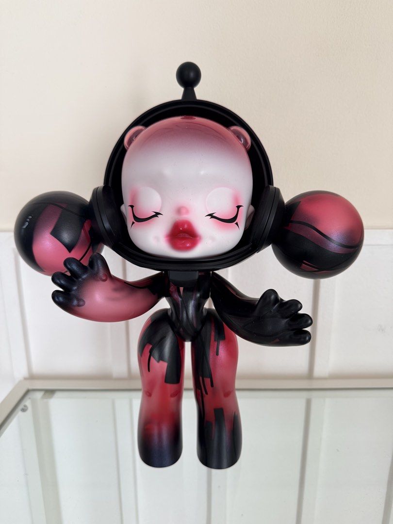 Popmart Skull Panda 400% (Category: Figurines & Statues) located in Cainta. Submitted by mskath__ (Listing ID 1464169845, Image 1). Description: - Unique designer art toy figure - Robot-like design with red and black accents - Pink gradient head with closed eyes and makeup - Includes a separate base piece - Stands approximately 8-10 inches tall - Perfect for collectors - no box.