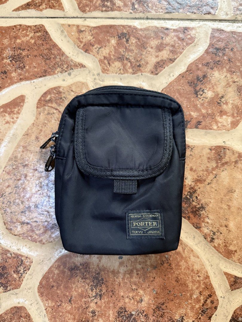 Porter Tokyo Black Nylon Pouch Bag “Authentic” (Category: Sling Bags) located in Cavite. Submitted by stolengoods116 (Listing ID 1464236416, Image 1). Description: Black Porter Tokyo pouch. Made from durable nylon. Has a main zippered compartment and a smaller front pocket. The back has a strap with a buckle and a D-ring. Great for carrying essentials. Compact size..