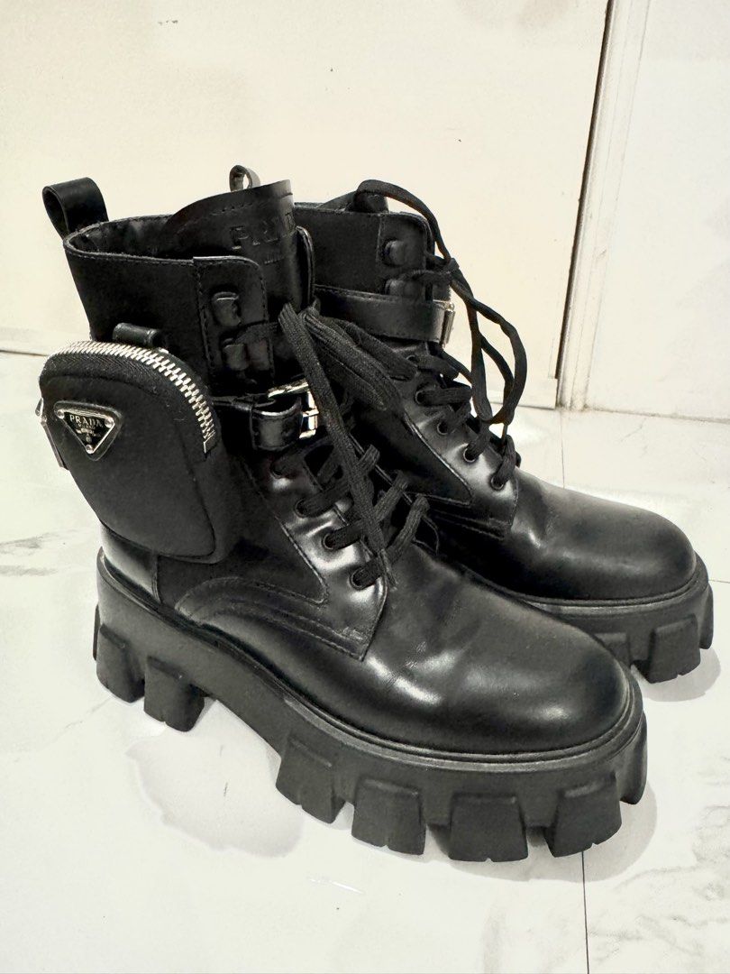 Prada Black Leather Combat Boots with Pouch (Category: Boots) located in Caloocan City. Submitted by fastfire-6117 (Listing ID 1464242897, Image 1). Description: - Authentic Prada black leather combat boots - Chunky platform sole for a stylish look - Lace-up front with an adjustable buckle strap detail - Detachable pouch on the side for added functionality - Perfect for everyday wear.