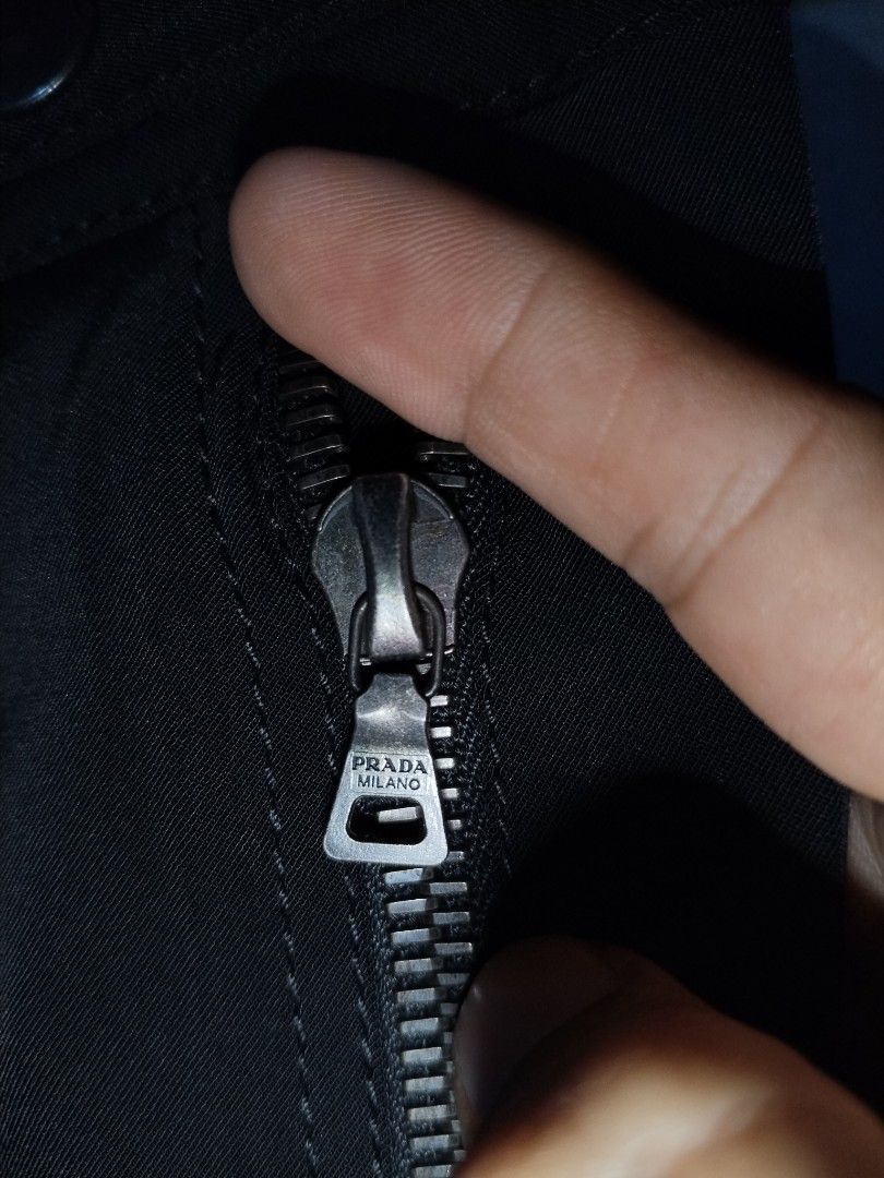Prada Black Zip Detail Slim Trousers (Category: Announcements) located in Pasig City. Submitted by loveforlux_2025 (Listing ID 1464342151, Image 3). Description: - Authentic Prada Pants - Size: 40 - 28" actual - Made in Italy - Features zip details on front pockets - Classic straight leg cut.