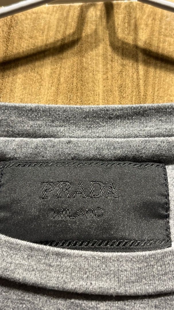 Prada Enamel Triangle Logo Cotton T-Shirt (Category: Luxury Apparel) located in Makati City. Submitted by tonyalavaro (Listing ID 1464249785, Image 3). Description: Selling Prada Enamel Triangle Logo Cotton T-Shirt there is a missing steel cog..