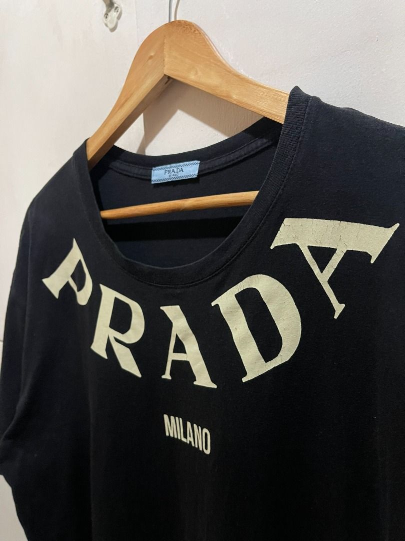 PRADA MILANO 'NECK SCRIPT' SHIRT (Category: Tshirts & Polo Shirts ) located in Manila. Submitted by ako.si.lemmor (Listing ID 1464279686, Image 3). Description: This item is thrifted, manage your expectation. Dimes: 21.5.X28 (L-XL) Color rate: 8.5/10 Issue: Slight color fade, cut wash tag, print cracks Ship at your own cost or pickup Mandaluyong..