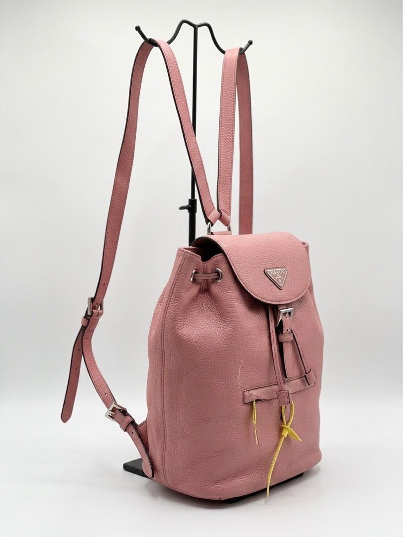Prada Pink Backpack (Category: Luxury Bags & Wallets) located in Adams. Submitted by princess.maggie (Listing ID 1464235653, Image 1). Description: - good condition - LAMPO zip - not sure if og - ukay source -may minor peel lang at front and sa pinakabbaa .