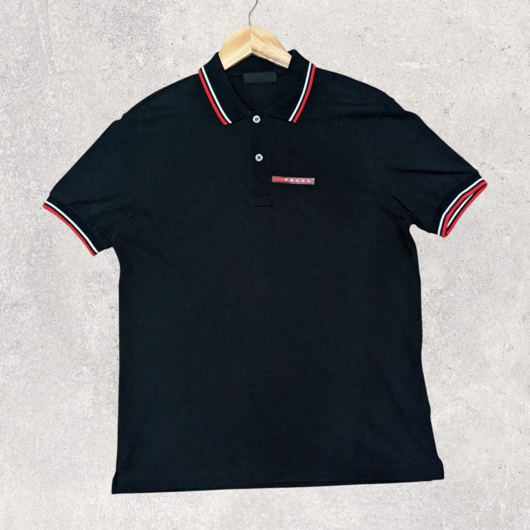 Prada Polo Shirt (Category: Luxury Apparel) located in San Juan City. Submitted by 4keeps.mnl (Listing ID 1464279439, Image 1). Description: AUTHENTIC ✅ ORIGINAL Condition: 9.8/10 Small Issue: NONE.