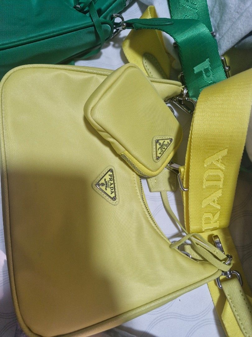 Prada Re-Edition 2000 Nylon Bag - Green & Yellow (Category: Luxury Bags & Wallets) located in Quezon City. Submitted by mc397m (Listing ID 1464214880, Image 3). Description: - Location: Visayas Ave QC - Available in vibrant Green and bright Yellow - Signature Prada nylon material - Sleek silver-tone hardware - Includes a convenient detachable pouch - Adjustable shoulder strap with Prada branding - Comes with original dust bags - Adds a stylish po