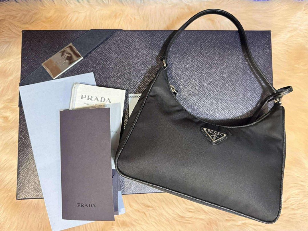 Prada Re-Edition 2005 Nylon Shoulder Bag Black (Category: Luxury Bags & Wallets) located in Porac. Submitted by goldenforest_ae5e0c (Listing ID 1464138604, Image 2). Description: - Authentic Prada Re-Edition 2005 shoulder bag - Color: Black - Material: Nylon - Hardware: Silver - Closure: Zipper - Includes: Original box and authenticity cards - Style: Classic, versatile, great for daily use.