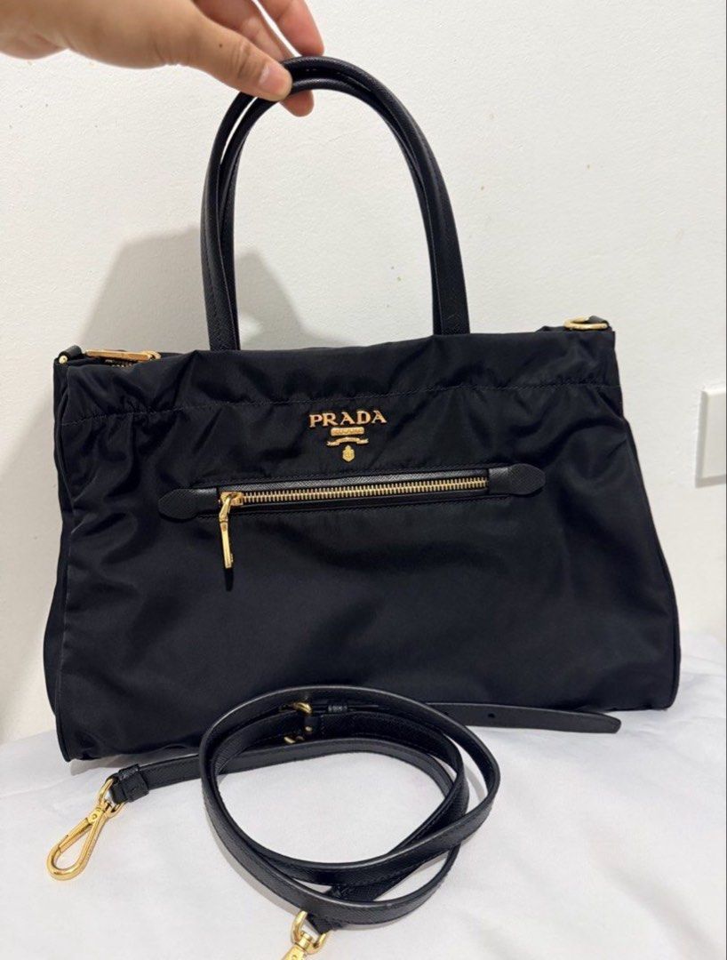 Prada two way (Category: Luxury Bags & Wallets) located in Manila. Submitted by prelovedbyramiah (Listing ID 1464286959, Image 1). Description: slight used with certificate of authenticity.
