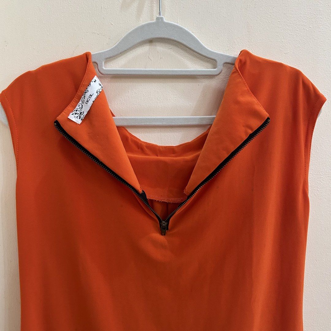 Preloved | Vibrant Orange Sleeveless Blouse (Category: Sleeveless) located in Caloocan City. Submitted by trisdeclutters (Listing ID 1464230481, Image 3). Description: Last price already Bust: 34" Length: 23" Pleated neckline Flaw: see last photo (stain) ‼️no reservations, exchange, cancellation, return, refund‼️.