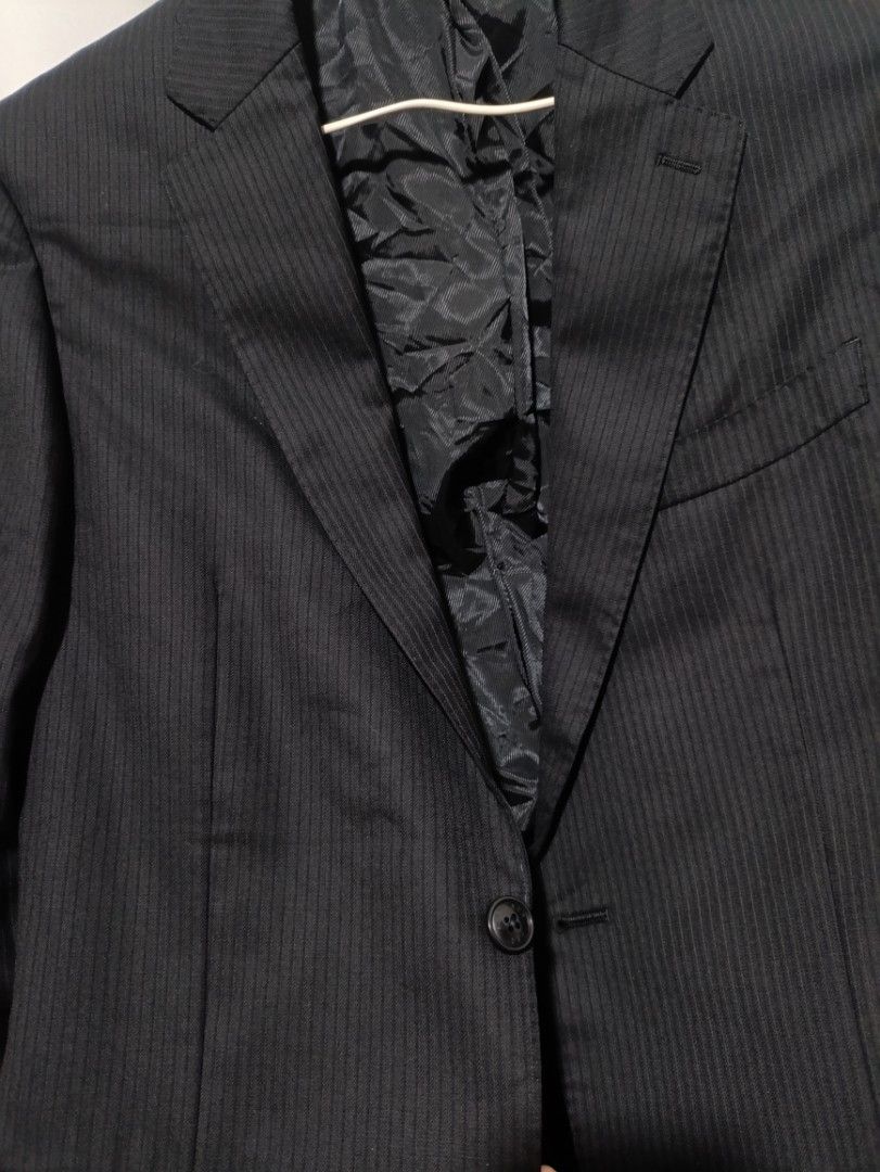 Premium BF Blazer in Black Pinstriped (Category: Coats, Jackets and Outerwear) located in Taguig. Submitted by vm.co (Listing ID 1460262196, Image 3). Description: Perfect for: * Corporate office wear * Business travel * Smart casual outfits * Rainy or cool weather * Capsule wardrobe * Everyday sophisticated styling Condition: Appears to be in very good preloved condition with no visible major stains, tears, or discoloration in the photo. A light