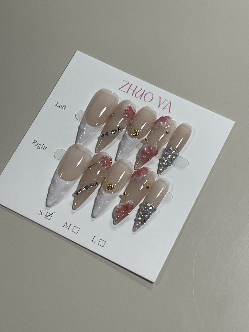 Press-On Nails Set (Category: Hands & Nails) located in Manila. Submitted by pattynginnga (Listing ID 1464190922, Image 3). Description: ✨ Brand New Press-On Nails — Never Worn! ✨ Bought these because I loved the designs, but I ended up never wearing them, so I’m letting them go to someone who’ll actually get to enjoy them! 🥹💅🏻 🌸 Beautiful floral designs with sparkly rhinestone details 💎 Super pretty and eye-catching 📦 Brand new / never wor