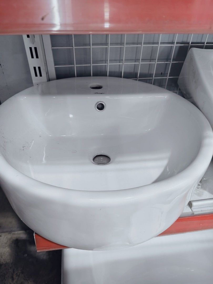 Prestige Ceramic Basin Sink (Category: Bathroom & Kitchen Fixtures) located in Marilao. Submitted by zettevibar (Listing ID 1464297465, Image 1). Description: - White ceramic basin sink - Two pre-drilled holes for faucet and soap dispenser - Ideal size for bathrooms - Clean and simple design - Ready for installation.