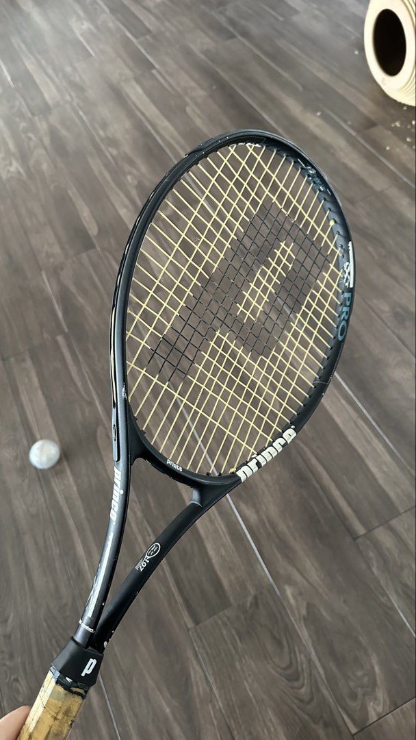 Prince Pro Series Tennis Racket (Category: Racket and Ball Sports) located in Manila. Submitted by waldorf024 (Listing ID 1464213755, Image 3). Description: - Prince Pro Series aluminum tennis racket - String Pattern: 16 mains / 19 crosses - Recommended Tension: 50-65 lbs - Currently Strung With: Prince Tournament Nylon - Condition: Good, with minor scuffs on the frame (original grip has been removed) .