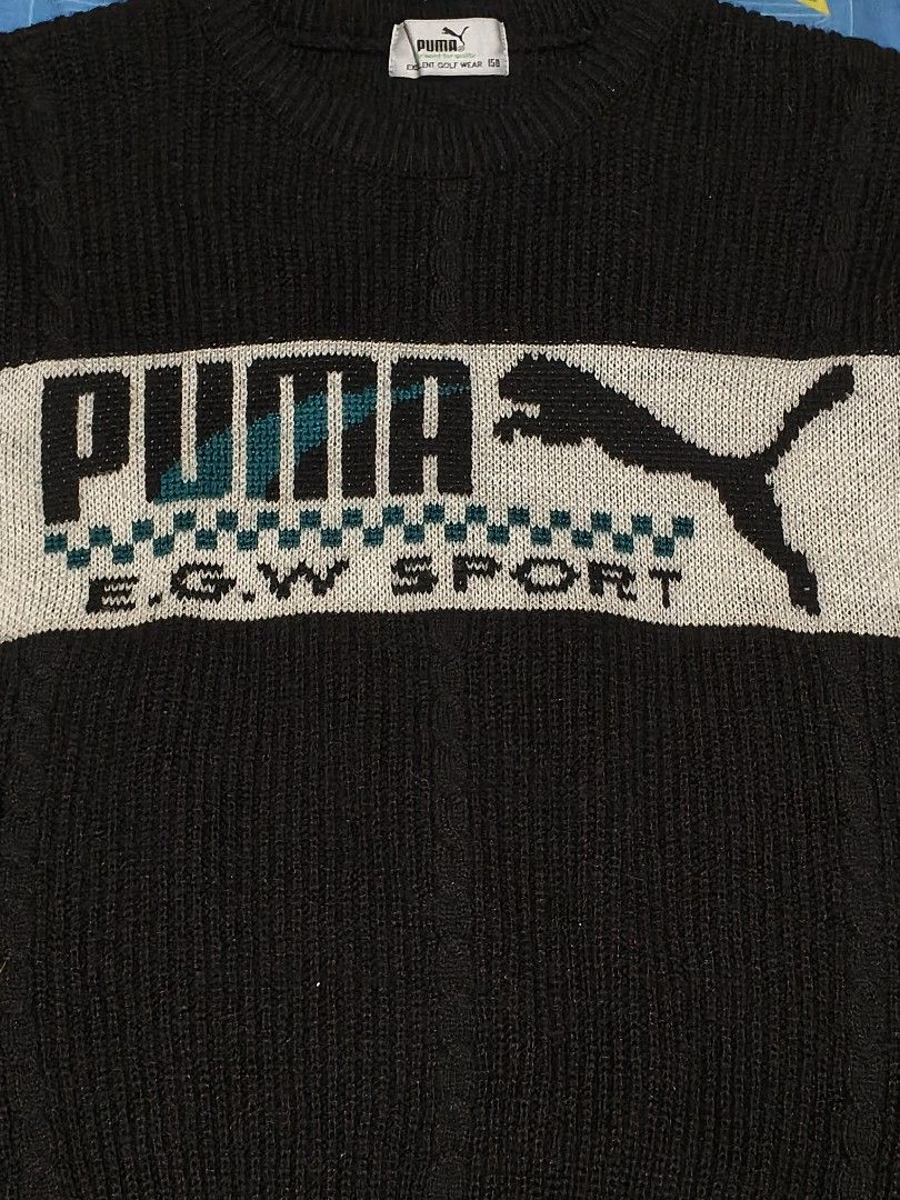 PUMA Black Knitted Sweater (Category: Coats, Jackets and Outerwear) located in Baguio. Submitted by oberdosed (Listing ID 1464346489, Image 2). Description: PUMA Black Knitted Sweater A sporty yet elevated black knit with a slightly cropped, fitted silhouette. Measurements: Length: 19.5" | Width: 18" | Sleeves: 20".