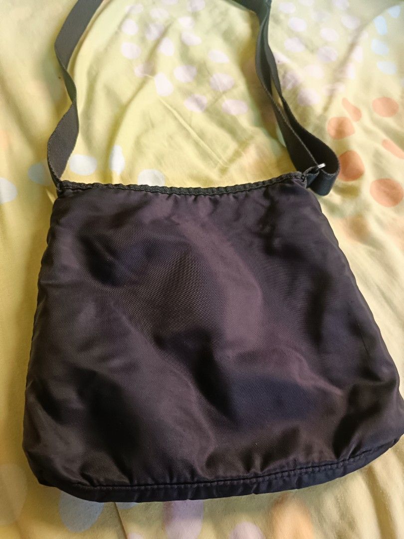 Puma crossbody sling bag (Category: Cross-body Bags) located in Antipolo. Submitted by ynut143 (Listing ID 1464156291, Image 2). Description: nylon material easy to carry kind of bag 25x23x3cm pls see last two photos for issue.