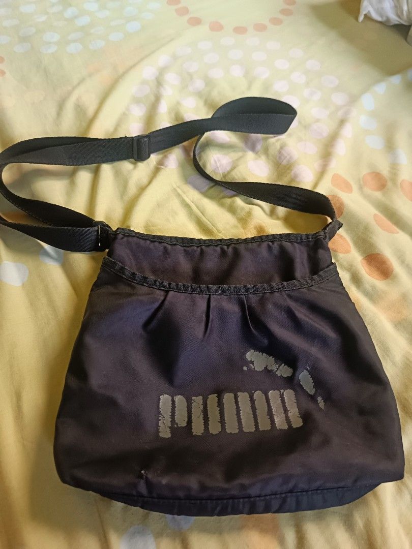 Puma crossbody sling bag (Category: Cross-body Bags) located in Antipolo. Submitted by ynut143 (Listing ID 1464156291, Image 1). Description: nylon material easy to carry kind of bag 25x23x3cm pls see last two photos for issue.