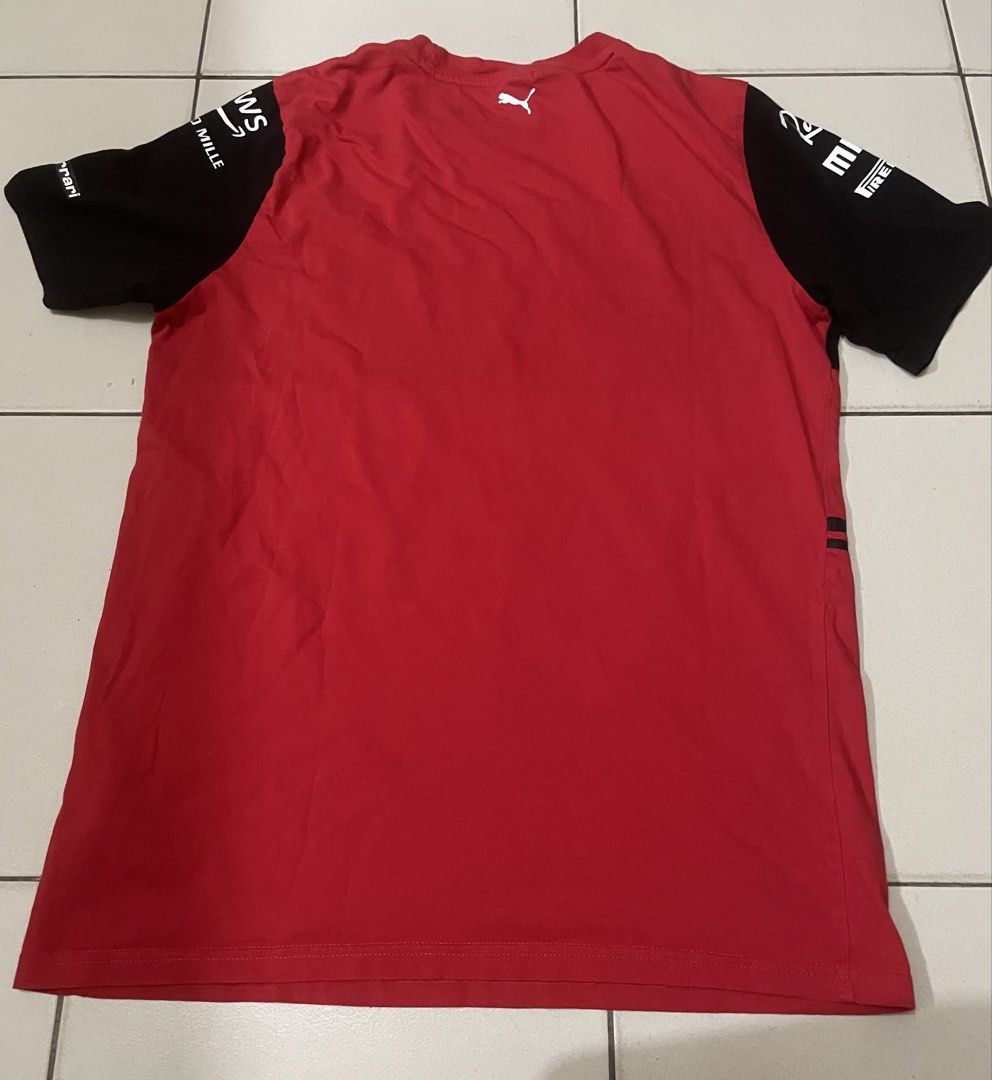 Puma Ferrari T-Shirt Size S (Category: Tshirts & Polo Shirts ) located in Manila. Submitted by sellingthings.xx (Listing ID 1464294381, Image 2). Description: - Authentic Red & Black Puma Ferrari T-shirt - Size: S - Features sponsor logos: Shell, Santander, CEVA - Sleeve details: Richard Mille and AWS logos - Color Rate: 9.5/10 - Dimes: Length 20 Width 26 - Issue: Crack Prints lang po - Condition: Good - Negotiable - Courier: Lalamove or pick up 