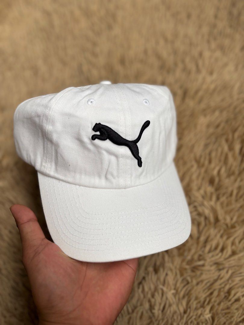 Puma White Cap with Black Logo (Category: Caps & Hats) located in Quezon City. Submitted by nojthrift (Listing ID 1464251646, Image 2). Description: - Classic white Puma cap - Iconic black Puma logo on the front - Adjustable strap at the back for a comfortable fit - Great for everyday wear or sports - Simple and stylish design 550+ship only.