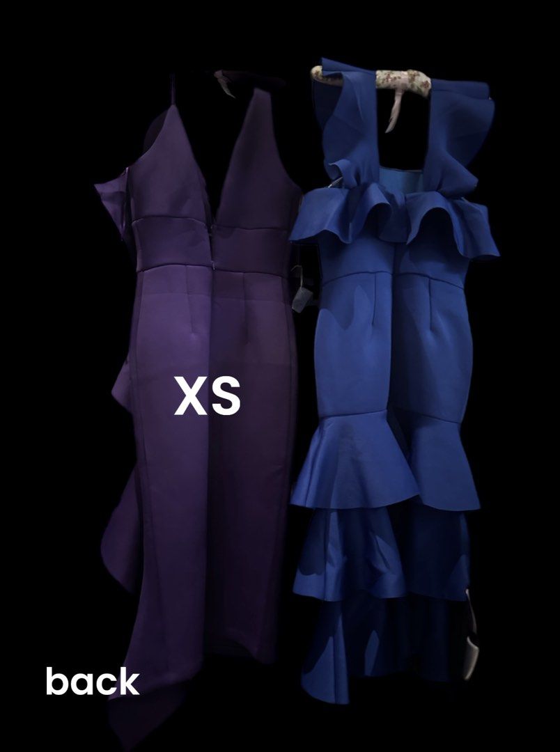 Purple & Blue Ruffle Dresses (Category: Dresses) located in Makati City. Submitted by allexxii (Listing ID 1464178520, Image 2). Description: - Two fitted dresses available. - Deep purple dress: Size XS, features a single ruffle down the side. - Vibrant blue dress: Features multiple ruffles on the shoulders and skirt. - Please check photos for detailed views of both dresses. - Length by inches 42 - 2 pieces .