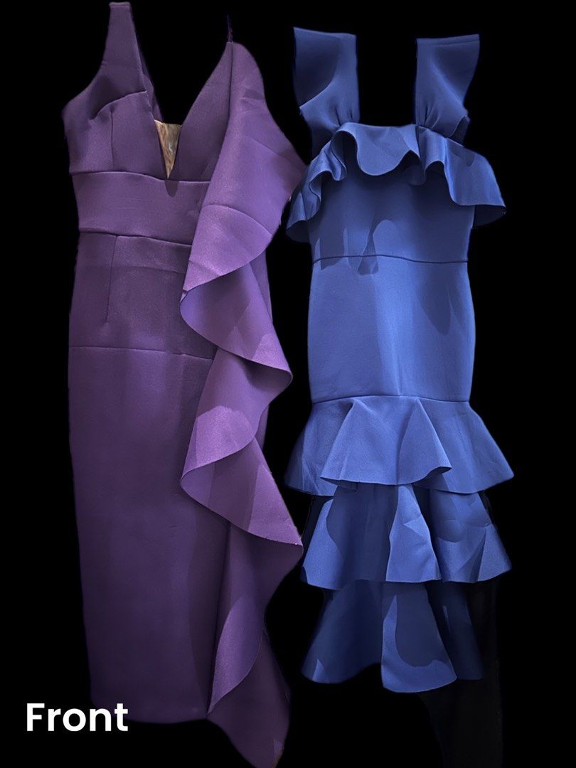Purple & Blue Ruffle Dresses (Category: Dresses) located in Makati City. Submitted by allexxii (Listing ID 1464178520, Image 1). Description: - Two fitted dresses available. - Deep purple dress: Size XS, features a single ruffle down the side. - Vibrant blue dress: Features multiple ruffles on the shoulders and skirt. - Please check photos for detailed views of both dresses. - Length by inches 42 - 2 pieces .