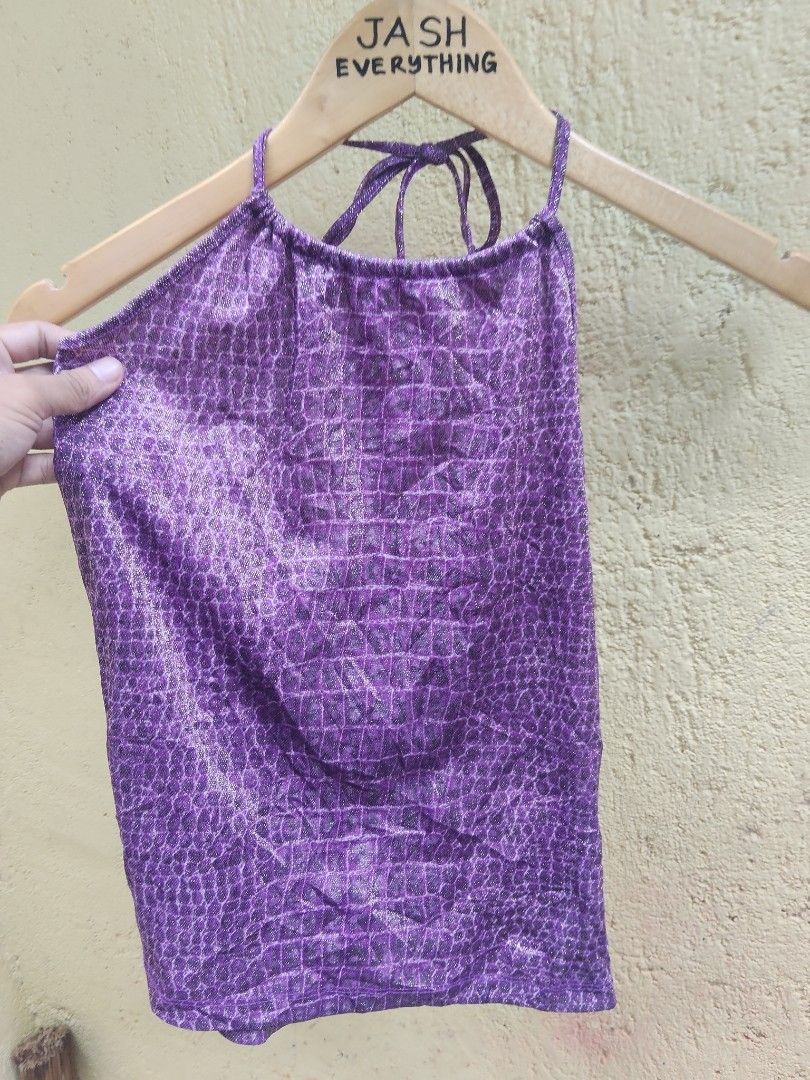 Purple Crocodile Print Halter Top (Category: Sleeveless) located in City of Isabela. Submitted by jasheverything (Listing ID 1464140190, Image 3). Description: - Adorable purple halter top - Unique crocodile print - Features a subtle shimmer in the fabric - Ties at the neck for an adjustable fit - Ideal for parties, festivals, or a fun night out - Flirty and eye-catching design Excellent Condition S to M 550+SF.