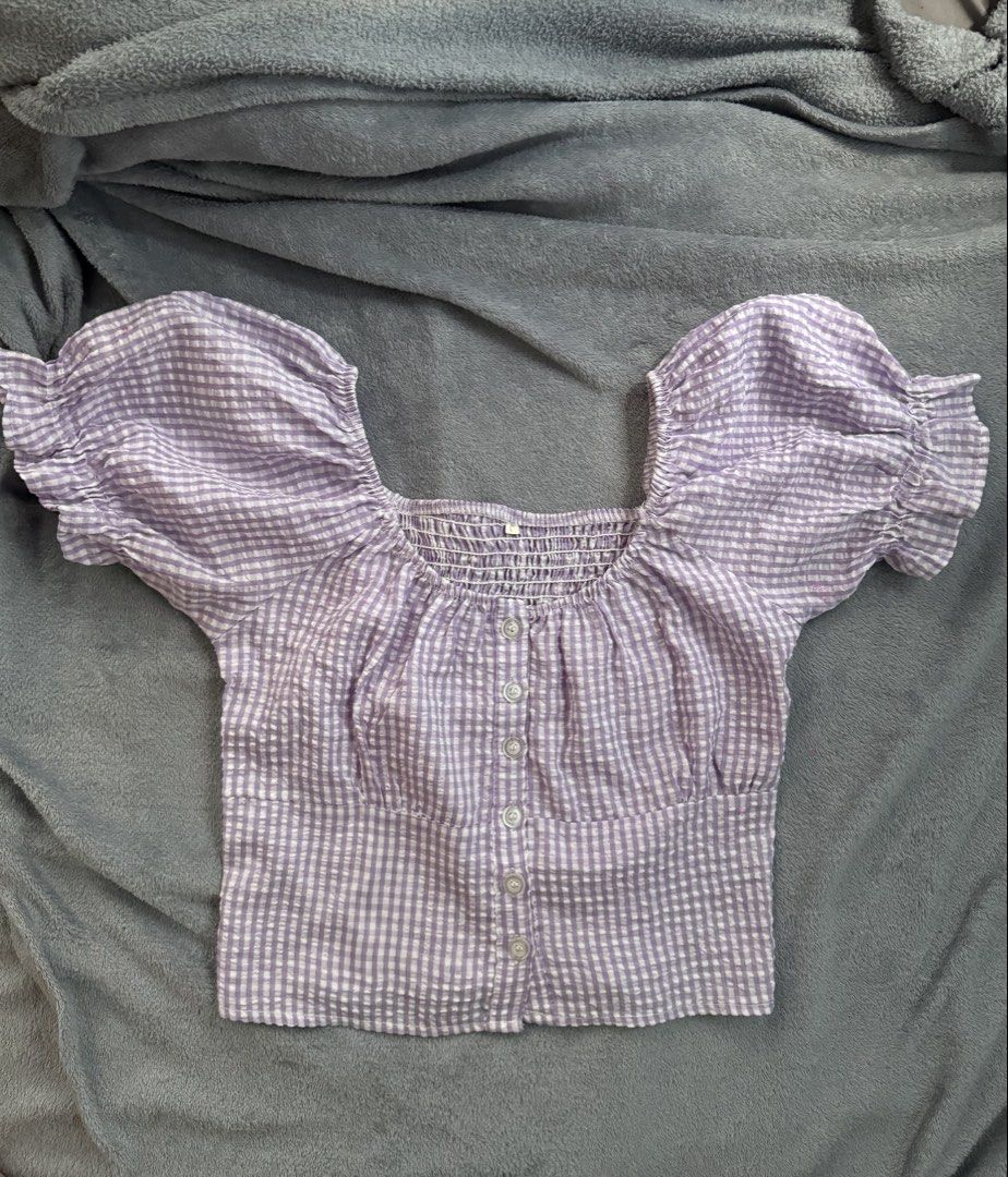 Purple Gingham Puff Sleeve Square Neck Crop Top (Category: Sleeveless) located in Manila. Submitted by razshen_29 (Listing ID 1464159748, Image 1). Description: - Adorable purple gingham crop top - Features a flattering square neckline - Stylish puff sleeves - Smocked bodice for a comfortable fit - Functional button details down the front - Textured fabric adds a unique touch - Ideal for casual wear, picnics, and sunny days.