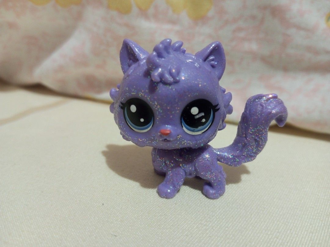 Purple Glitter Cat Toy Figure (Category: Designer & Blind Box Toys) located in Victorias. Submitted by tobylacua26871 (Listing ID 1464270601, Image 1). Description: - Adorable purple glitter cat toy - Features a sparkly finish all over - Cute big eyes and a fluffy tail - Perfect for collectors or as a fun toy.