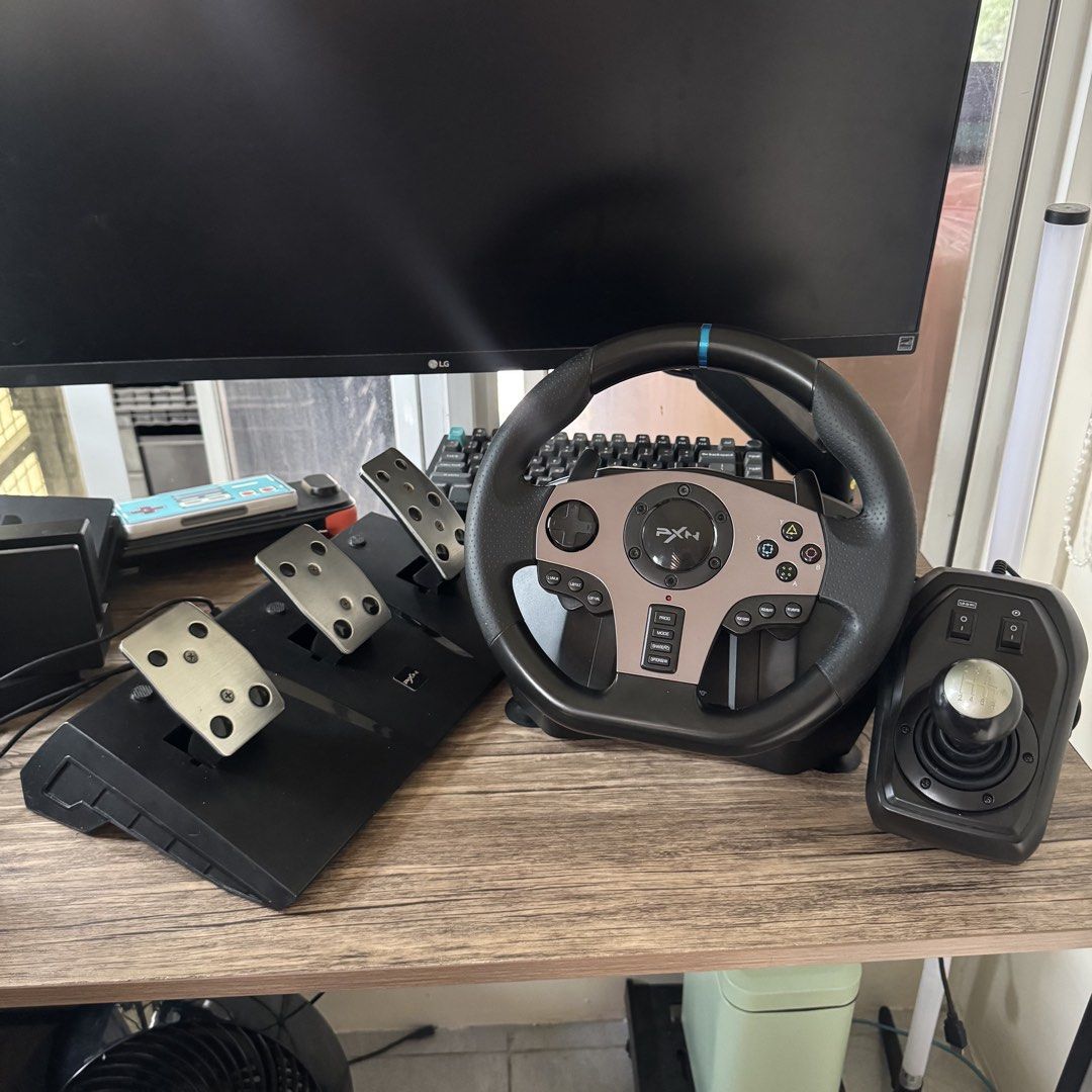 PXN V9 Racing Wheel PS4 PC XBOX NINTENDO SWITCH (Category: Controllers) located in Quezon City. Submitted by consoleciety (Listing ID 1464244054, Image 1). Description: PXN V9 Gen 1 Racing Wheel for sale ₱4,500 —complete set: wheel, pedals, shifter, clamp, and box (worn out box) —compatible with PC (Windows 7/8/10/11), PS4, PS3, Xbox One, Xbox Series X/S, and Nintendo Switch see pics for condition note: need mo tigasan yung pag-shift sa gear 1 ka