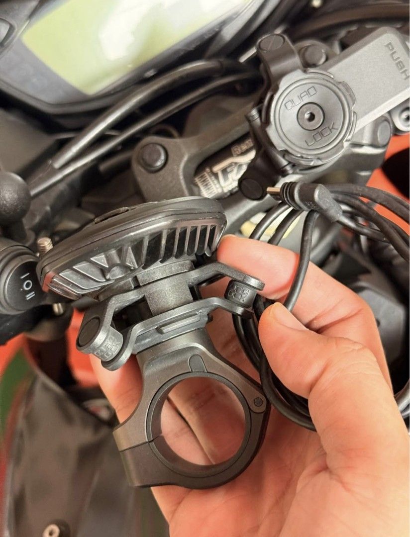 Quad Lock Motorcycle Wirless Charger and Handle bar Mount (Category: Chargers & Cables) located in Las Pinas. Submitted by xandyy (Listing ID 1464148541, Image 2). Description: - Quad Lock USB charger specifically for motorcycles. - Connects directly to your bike's battery for continuous power. - Securely mounts your smartphone with the reliable Quad Lock system. - Features the convenient Quad Lock quick-release mechanism. - Ideal for using your 