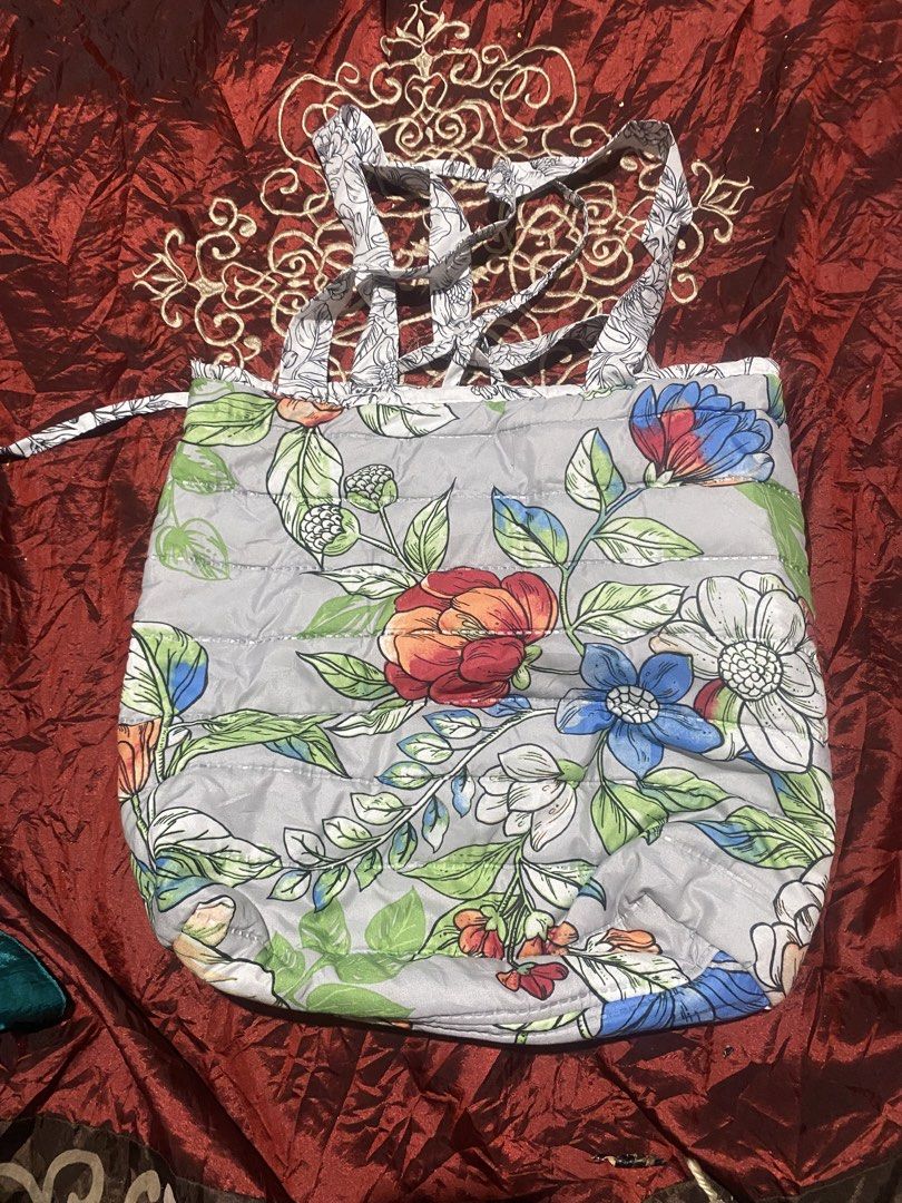 Quilted Floral Tote Bag (Category: Tote Bags) located in Manila. Submitted by reginemarquez412 (Listing ID 1464231835, Image 2). Description: - Stylish grey quilted tote bag - Features a colorful floral print - Black and white floral patterned straps - Ideal size for everyday use - Spacious interior for essentials - Great for shopping or daily errands.