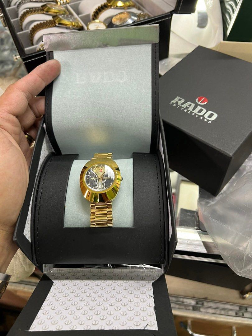 Rado Golden Watch with Diamond Dial (Category: Women's Watches) located in Quezon City. Submitted by karma_para_sa_bogus (Listing ID 1464187743, Image 2). Description: - Authentic Gold Rado Watch - Elegant Black Dial with Diamond Accents - Convenient Date Window at 6 o'clock - Includes Original Rado Box - Stunning and Versatile Design - Perfect for any occasion.