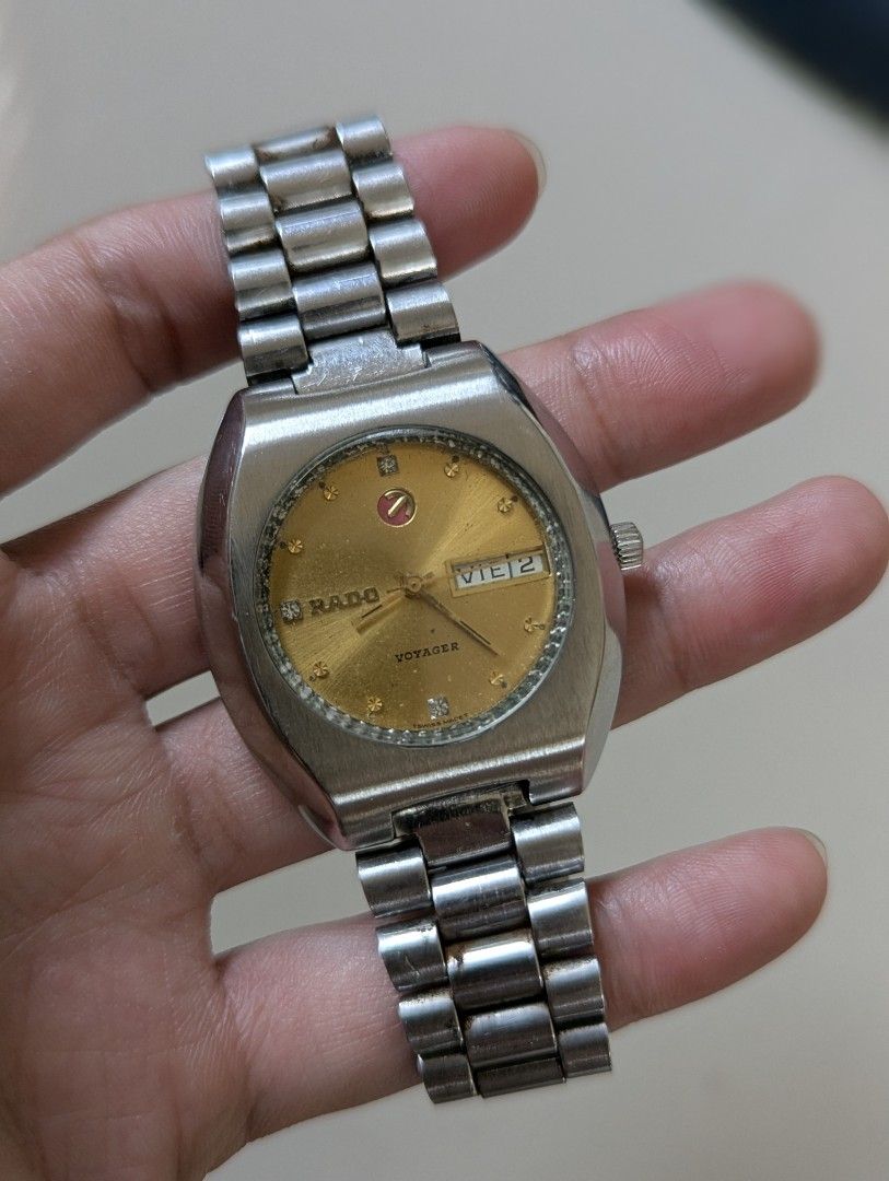 Rado Voyager Automatic Barrel Case (Category: Luxury Watches) located in Quezon City. Submitted by dustydialsph (Listing ID 1464210550, Image 2). Description: - Vintage Rado Voyager Automatic Watch - Features a Gold Dial with Day and Date Function - Stainless Steel Bracelet - Watch is running and in working condition - Ideal for watch collectors - Loose Backcase.