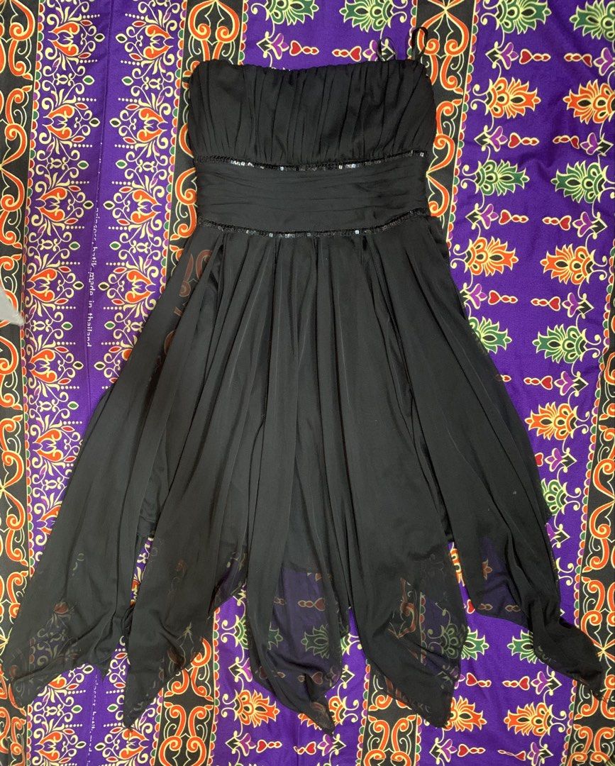 Ray Black Chiffon Dress (Category: Dresses) located in Cebu City. Submitted by goldencloud_f1507d (Listing ID 1464212055, Image 1). Description: This item is a vintage-style black strapless chiffon dress featuring a ruched bodice, a sequined waist band detail, and a flowing handkerchief (hanky) hemline. It strongly channels the whimsical goth, fairycore, and early 2000s (Y2K) aesthetic..