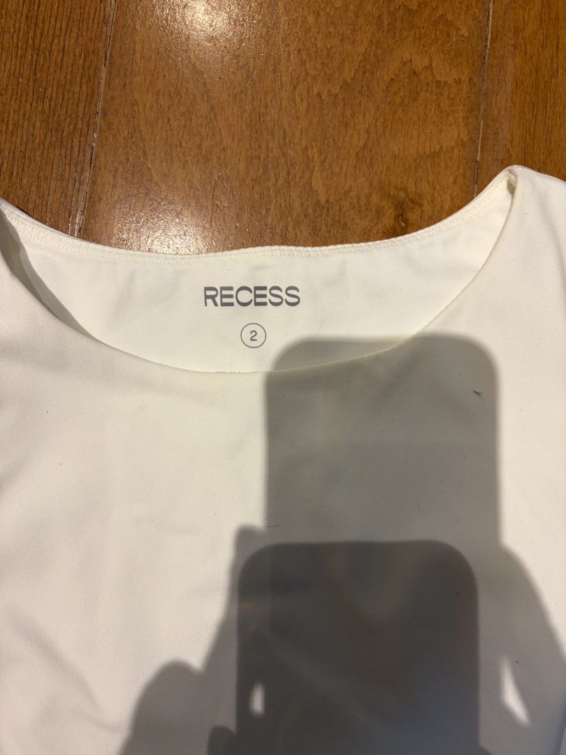 RECESS White Sleeveless Bodysuit Size small (Category: Sleeveless) located in Muntinlupa City. Submitted by secondhandlove12345 (Listing ID 1464276336, Image 2). Description: - Brand: RECESS - Color: White - Style: Sleeveless Bodysuit - Size: 2 - Features: Snap closure at the bottom - Versatile: Great for layering or wearing on its own - Material: Comfortable.