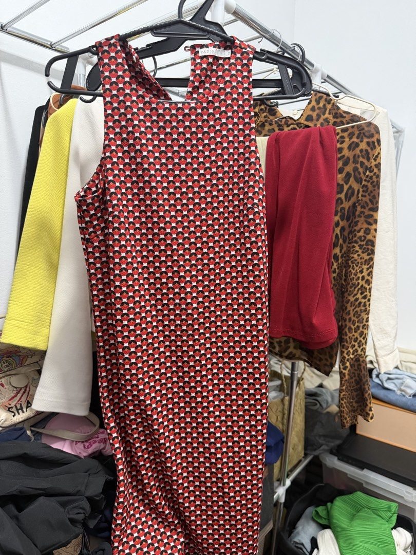Red Geometric Pattern Sleeveless Dress (Category: Dresses) located in Manila. Submitted by e.louise (Listing ID 1464334050, Image 1). Description: - Sleeveless dress - Bold red, black, and white geometric pattern - High neckline with a back cutout detail - Slightly textured fabric - Comfortable and flattering fit - Versatile: great for casual outings or dressing up.