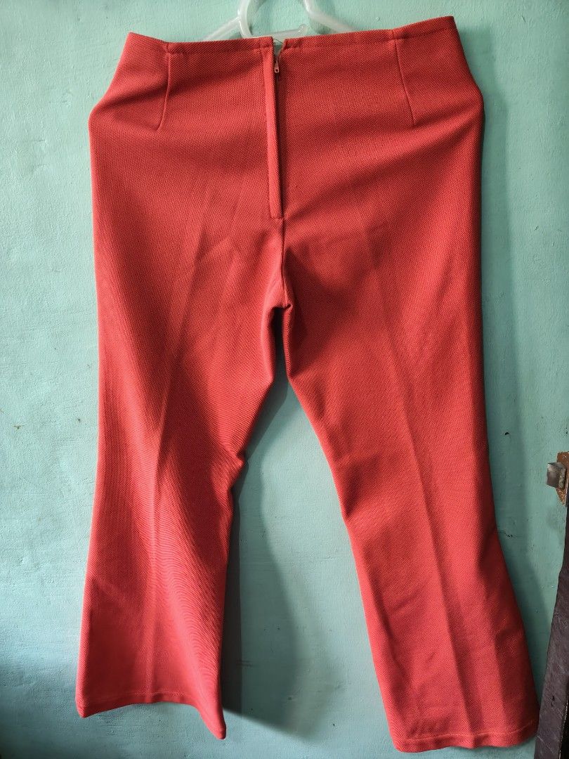Red High-Waisted Flare Pants (Category: Jeans) located in Mandaluyong City. Submitted by locolady (Listing ID 1464165746, Image 2). Description: - Trendy high-waisted red pants - Flared leg design for a stylish silhouette - Textured fabric adds a unique touch - Convenient back zipper closure - Perfect for dressing up or down.