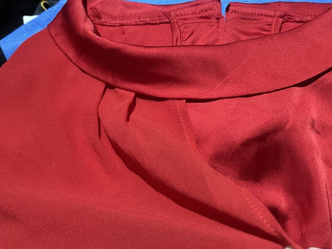 Red Silk Blouse with Mandarin Collar (Category: Blouses) located in Donsol. Submitted by saksthriftavenuebyluckymaria8 (Listing ID 1464281117, Image 2). Description: - Red short-sleeve blouse - Mandarin collar with back button closure - Pleated detail at the front neckline - Lightweight and slightly sheer fabric - Versatile for dressing up or down Red silk top Sz L chest 22in armhole 9.5in shoulder 17in length 24in 92% silk 8% spandex.