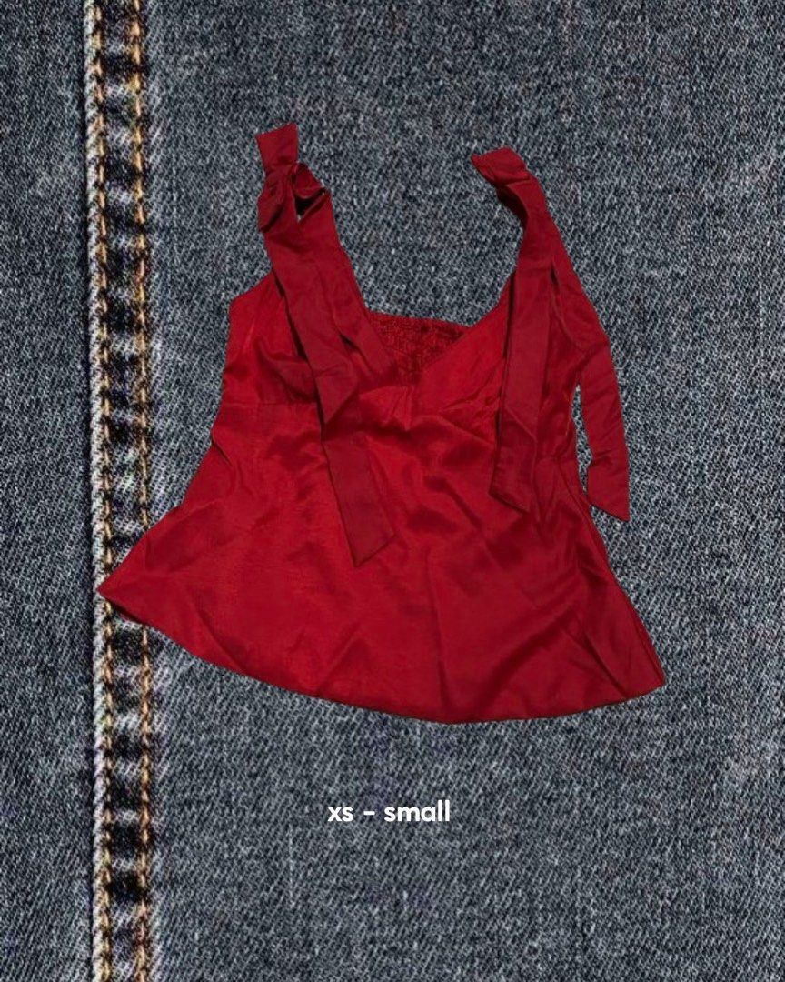 Red tie-strap cami top xs-small (Category: Sleeveless) located in Caloocan City. Submitted by zeal_aekigai (Listing ID 1464341574, Image 1). Description: Cute red silky cami top with tie straps. Fits XS-S. Perfect for day or night..