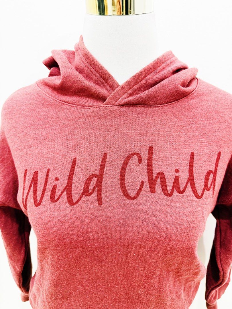 Red "Wild Child" Graphic Hoodie (Category: Hoodies) located in Manila. Submitted by e.louise (Listing ID 1464334407, Image 2). Description: - Cute red hoodie - Features 'Wild Child' graphic - Comfy and casual design - Ideal for everyday wear - Effortlessly pairs with jeans or leggings - Creates a relaxed vibe.