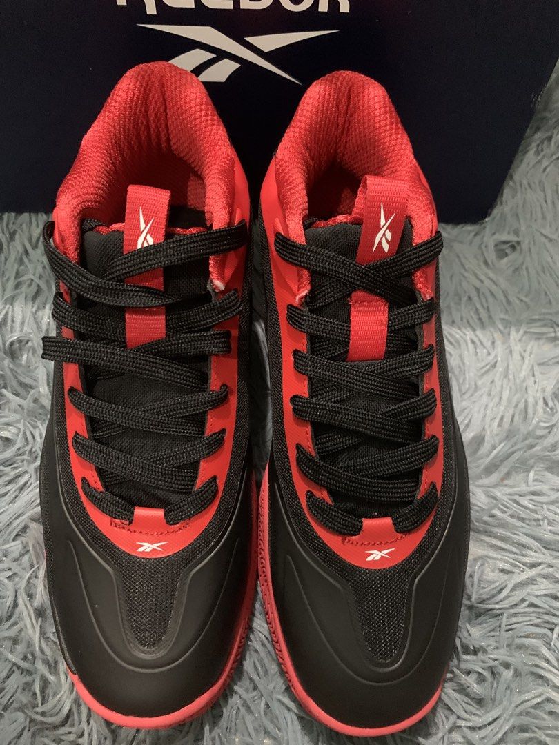 Reebok Basketball Shoes Red Black (Category: Sneakers) located in Manila. Submitted by apraeltrends (Listing ID 1464209396, Image 3). Description: - Reebok basketball shoes 6.5 US Boys - Color: Red and Black - Style: Mid-top - Features: Unique tread pattern on soles for superior grip - Laces: Black - Includes: Original box and tissue paper - Condition: Ready for your next game!.