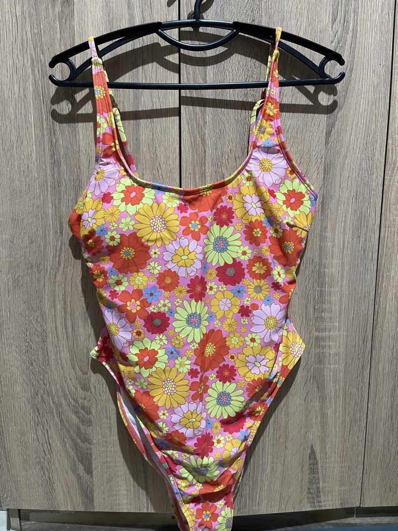 Retro Floral One-Piece Swimsuit (Category: Bikinis & Swimsuits) located in Manila. Submitted by preloveditems_jem (Listing ID 1464305016, Image 2). Description: Super cute one-piece swimsuit with a vibrant retro floral print. Pink, orange, yellow, and blue flowers all over. Features adjustable straps for a good fit. High-cut leg design. With removable padding. Great for the beach or pool. Ready for your next vacation!.